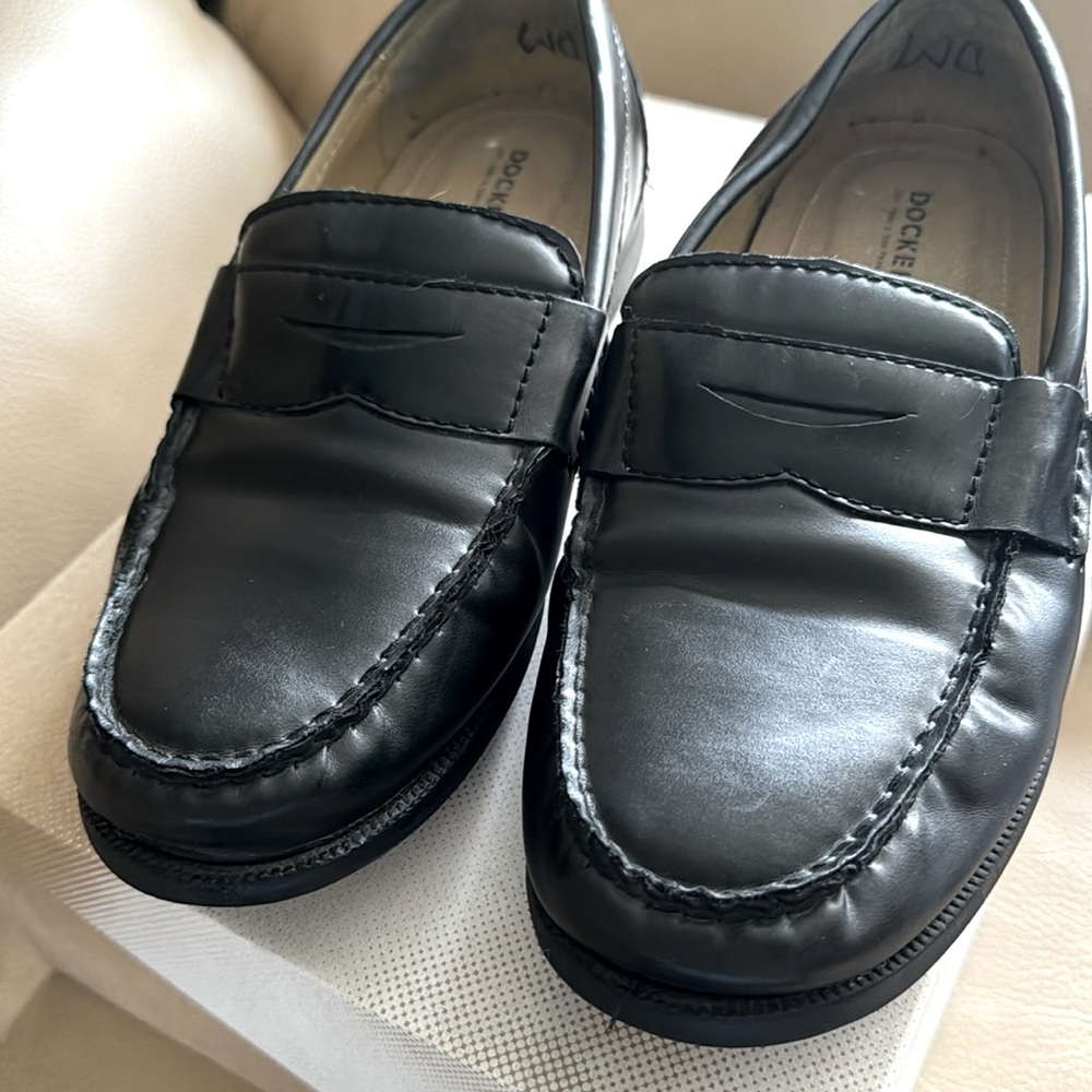 Men's black Dockers penny loafers.